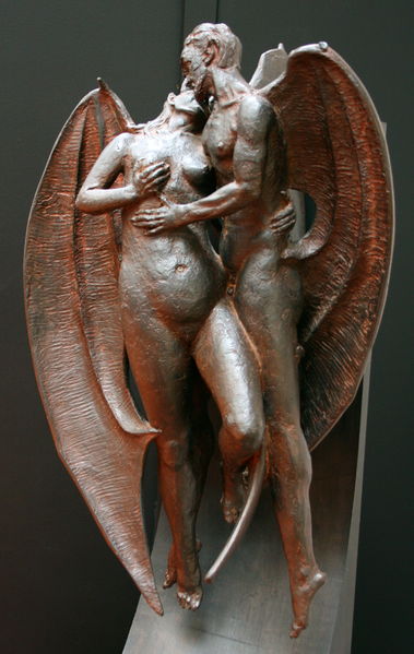 Statue of devil and woman